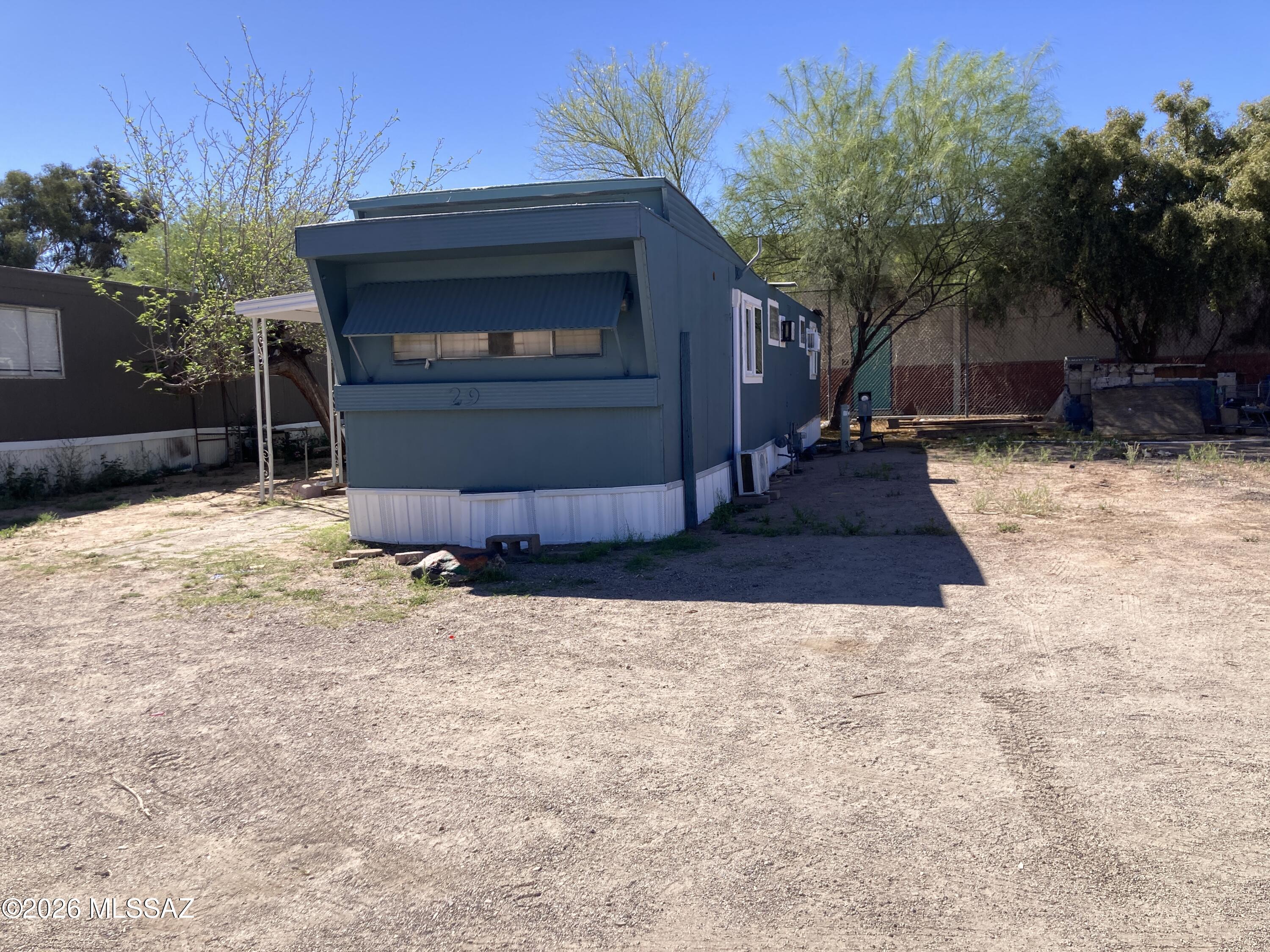 1741 West Wetmore Road, Unit 29 Tucson, AZ 85705 - Photo 2 of 10 a view of house and outdoor space
