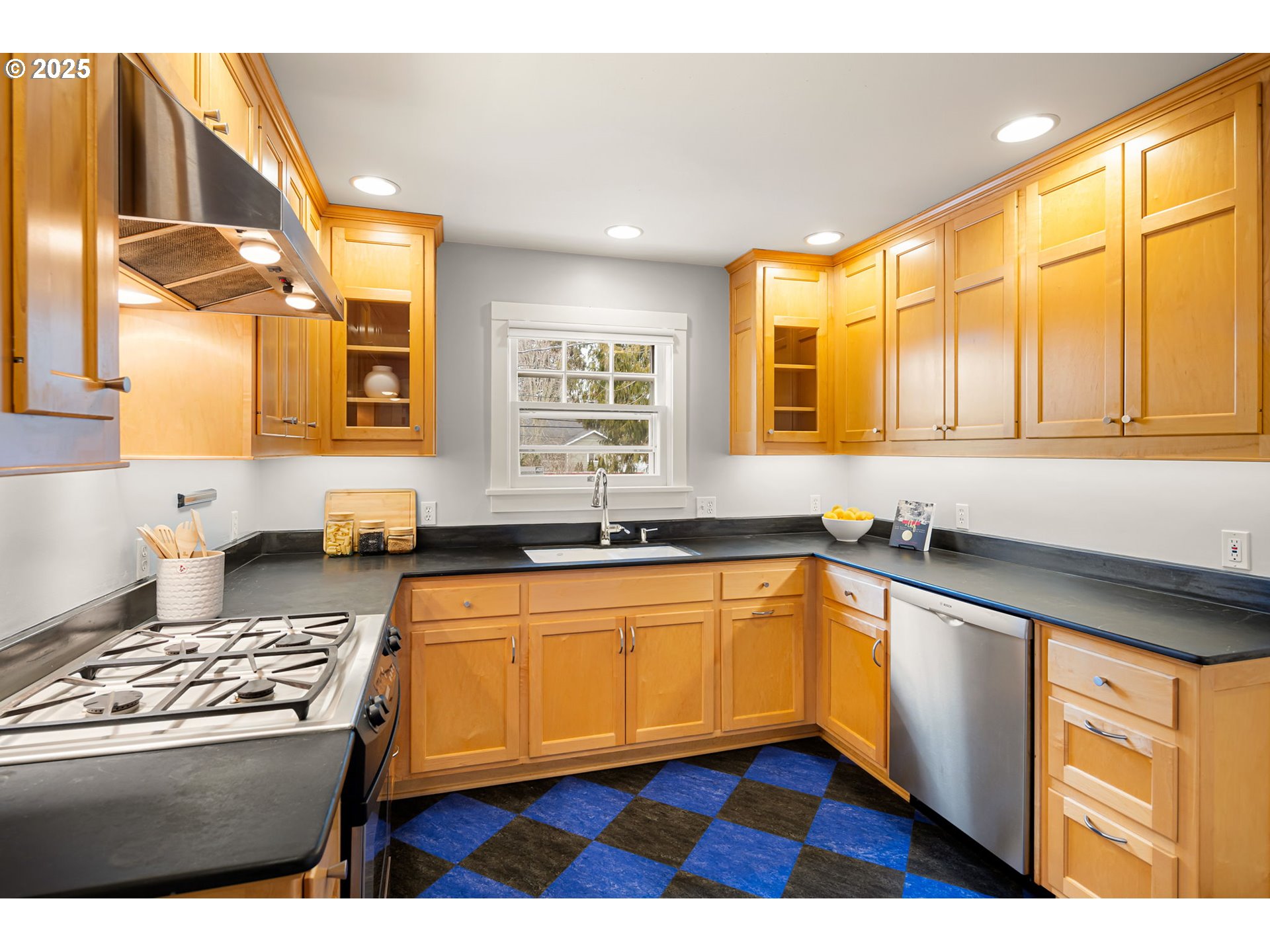 1944 Alder Street Eugene, OR 97405 - Photo 15 of 46 a kitchen with stainless steel appliances granite countertop a stove a sink and a microwave