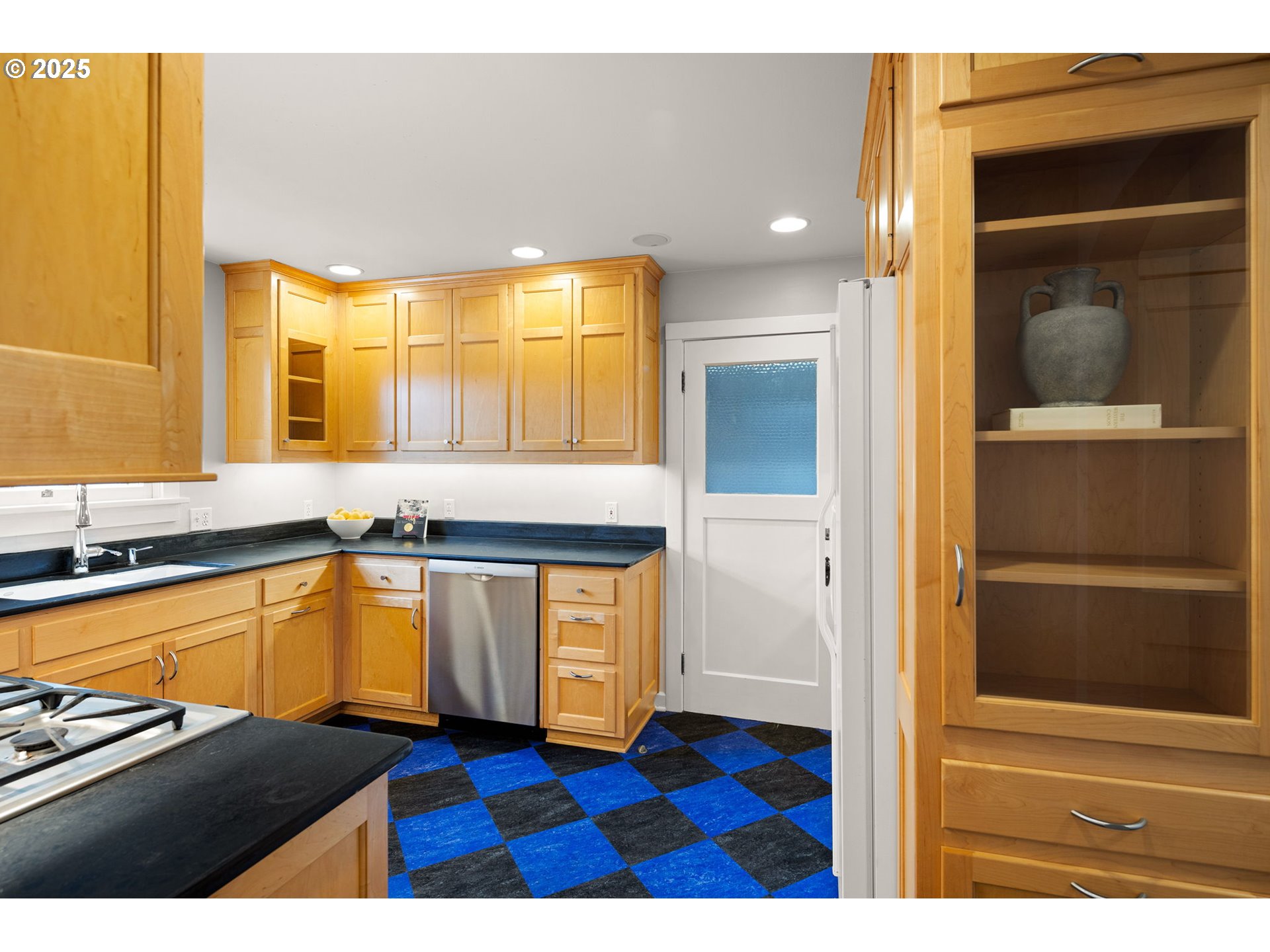 1944 Alder Street Eugene, OR 97405 - Photo 16 of 46 a kitchen with a sink and a refrigerator