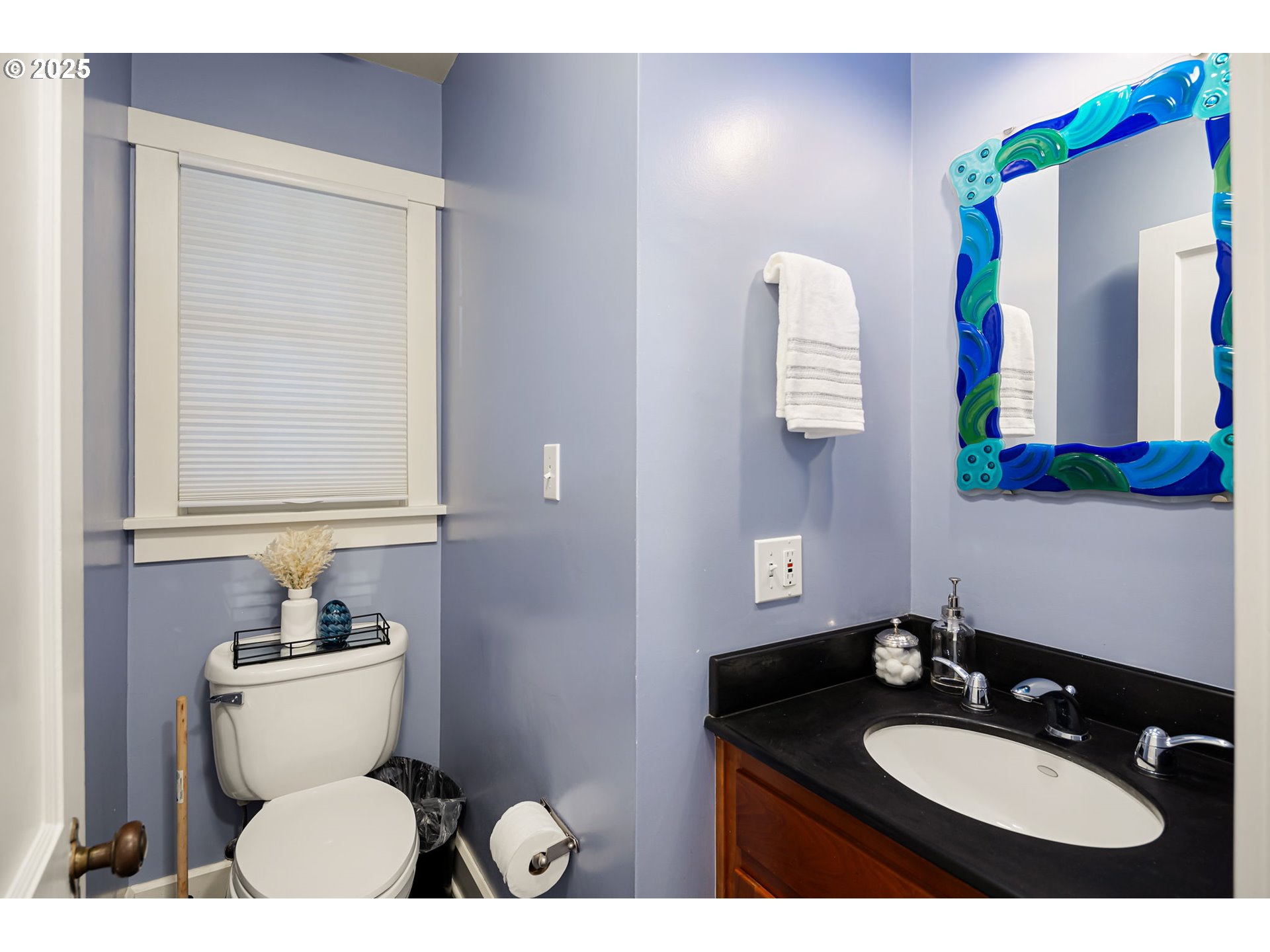 1944 Alder Street Eugene, OR 97405 - Photo 19 of 46 a bathroom with a sink vanity mirror and toilet
