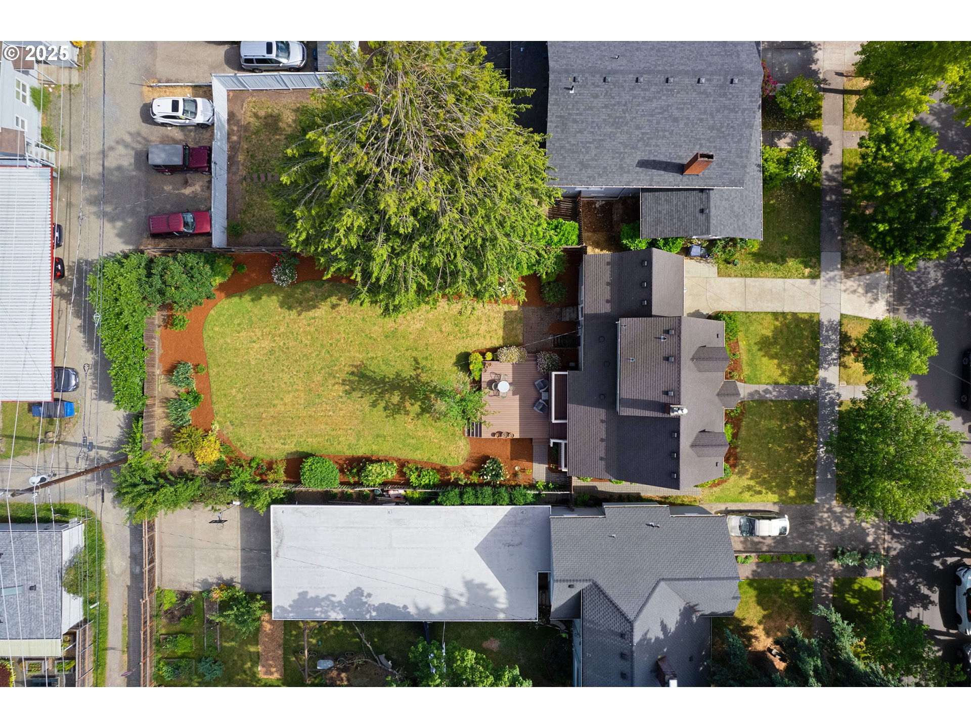 1944 Alder Street Eugene, OR 97405 - Photo 41 of 46 an aerial view of a house with a garden and yard