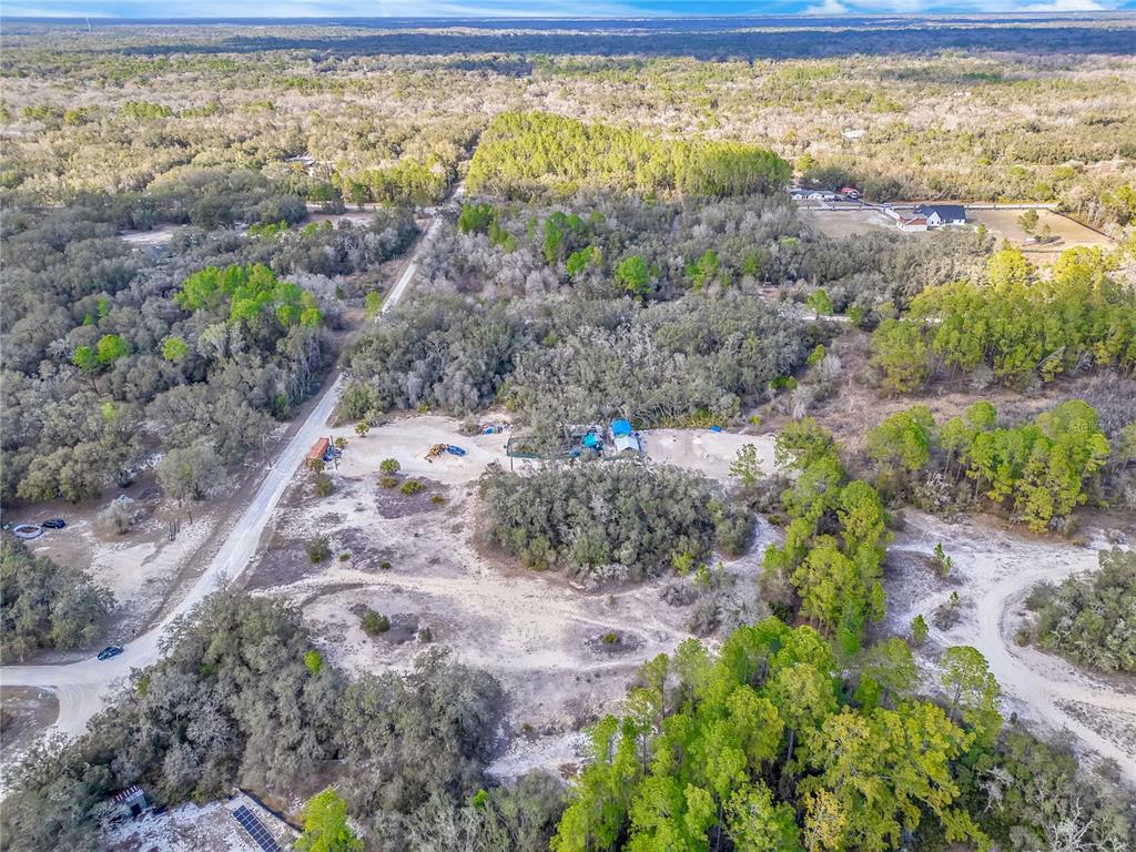 Goodstone Drive Webster, FL 33597 - Photo 18 of 20 a view of a garden with an outdoor space