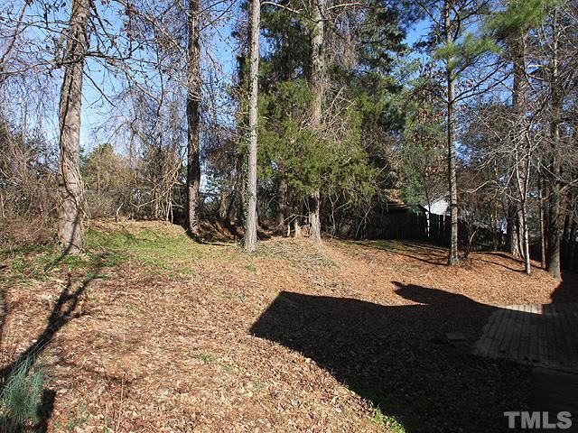 5425 Old Towne Road Raleigh, NC 27612 - Photo 11 of 13 LOTS OF MATURE TREES PROVIDE A PRIVATE FEEL IN THE LARGE FENCED IN BACKYARD