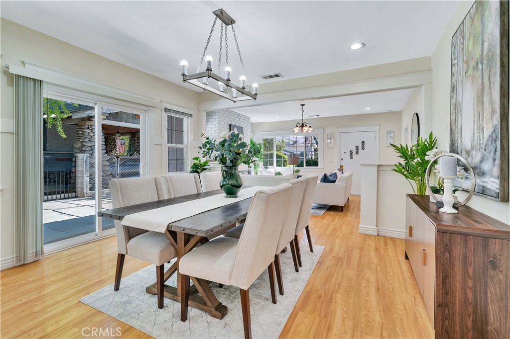 511-unit 1 Alvarado Street Redlands, CA 92373 - Photo 13 of 56 a view of a dining room with furniture wooden floor and chandelier