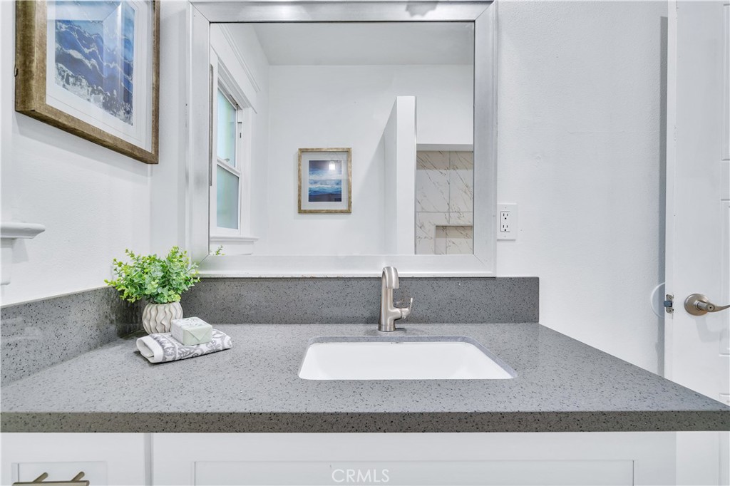 511-unit 1 Alvarado Street Redlands, CA 92373 - Photo 18 of 56 a bathroom with a sink and a mirror