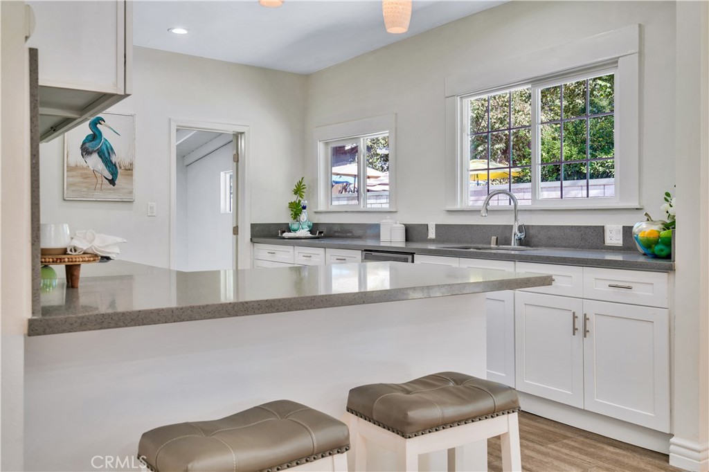 511-unit 1 Alvarado Street Redlands, CA 92373 - Photo 22 of 56 a kitchen with stainless steel appliances granite countertop a sink a stove a counter space and cabinets