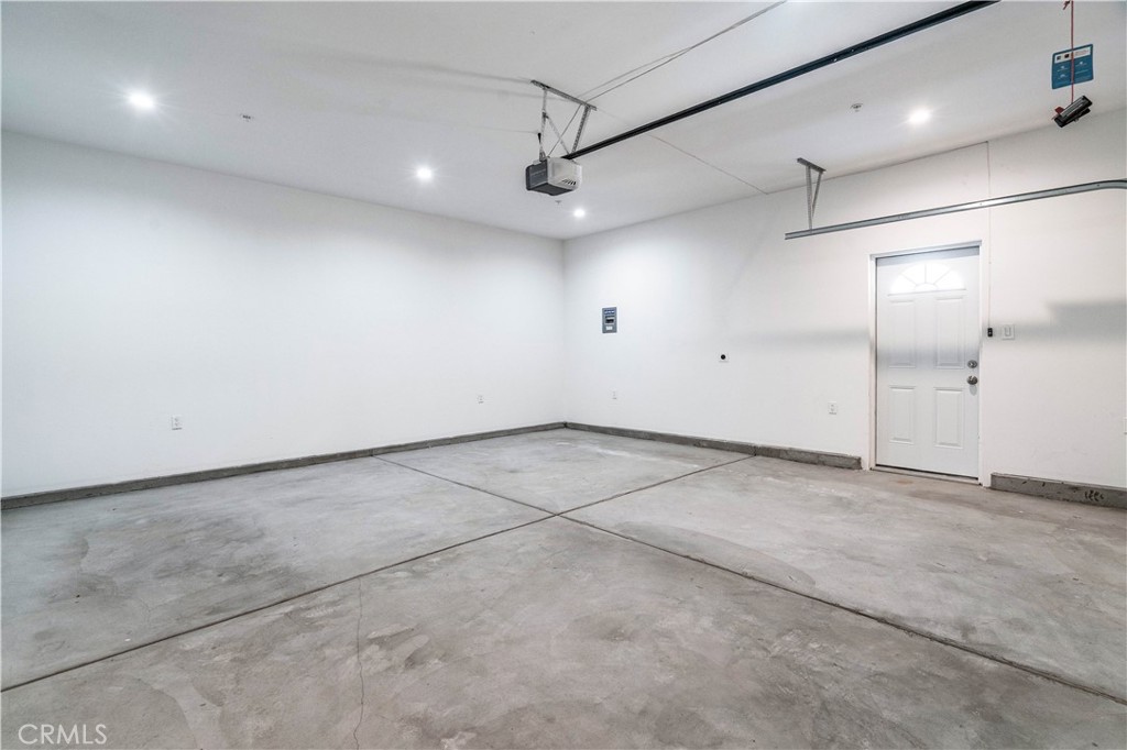 511-unit 1 Alvarado Street Redlands, CA 92373 - Photo 33 of 56 an empty room with a ceiling fan and windows