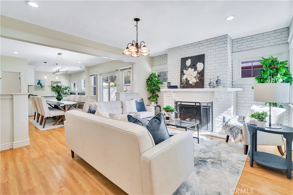511-unit 1 Alvarado Street Redlands, CA 92373 - Photo 9 of 56 a living room with furniture a fireplace and a chandelier