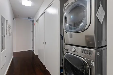 a view of a hallway with washer and dryer