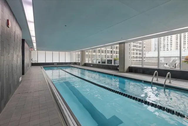 a view of swimming pool with seating area