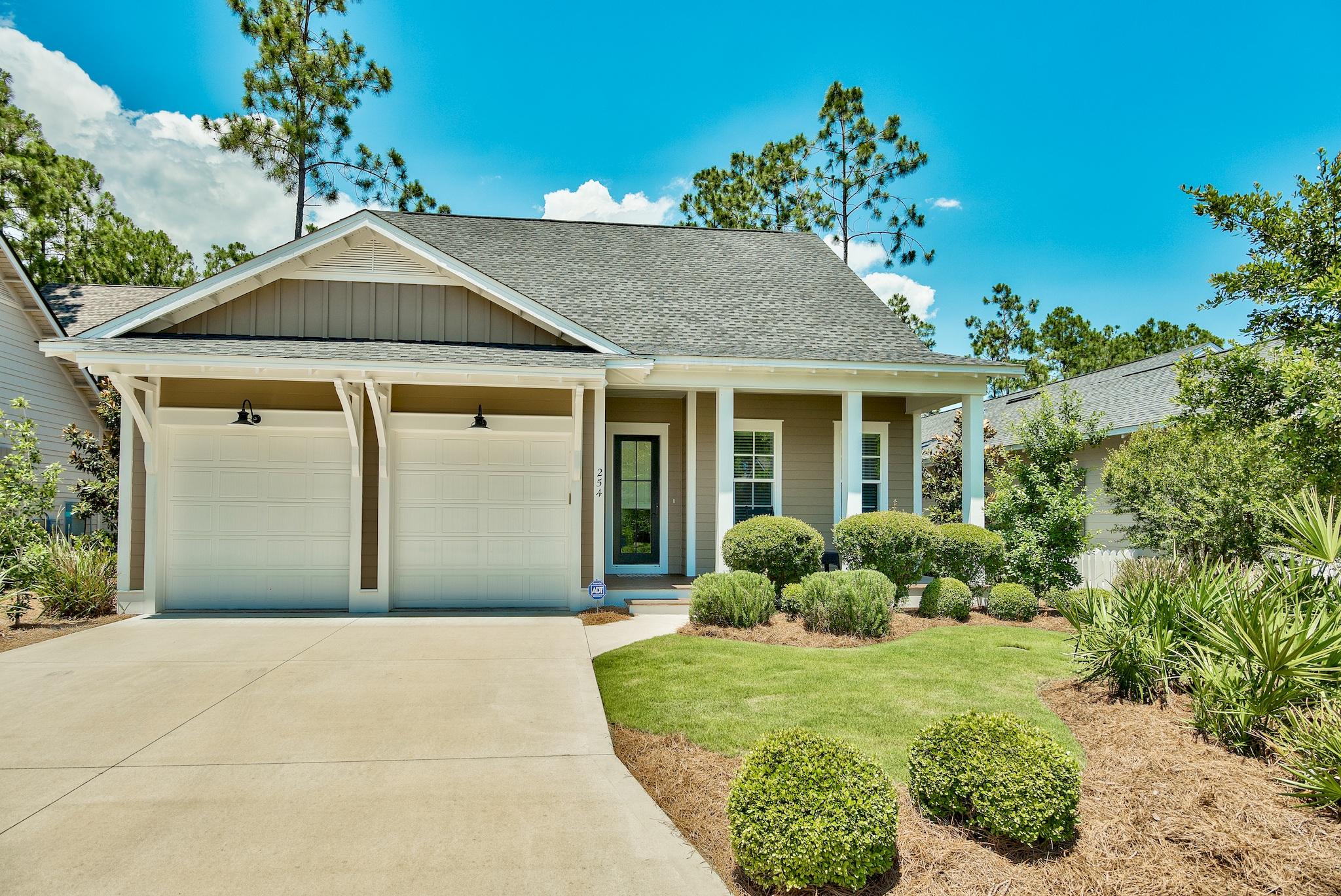 a front view of a house with garden