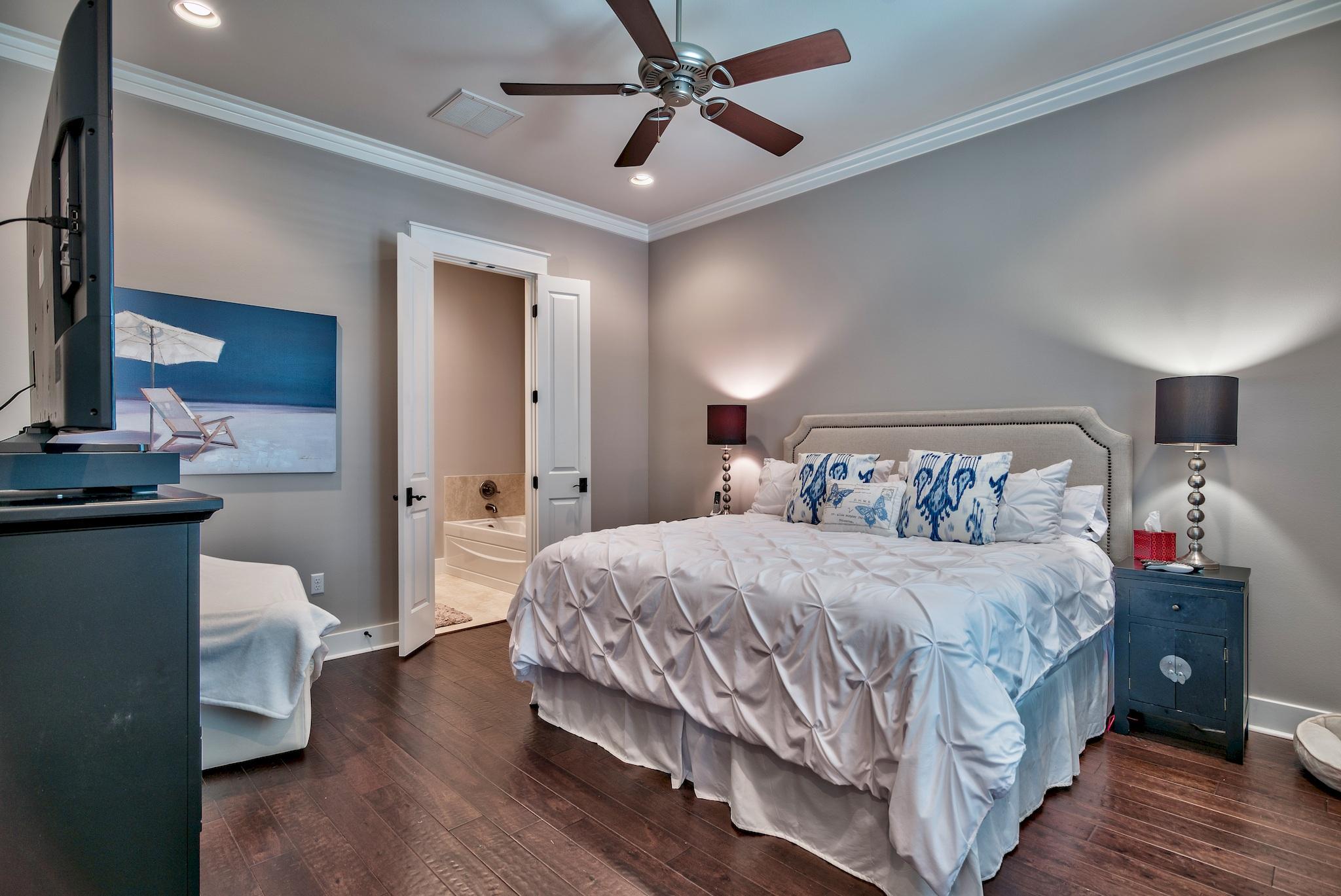 254 Jack Knife Drive Inlet Beach, FL 32461 - Photo 12 of 28 a bedroom with a bed and wooden floor