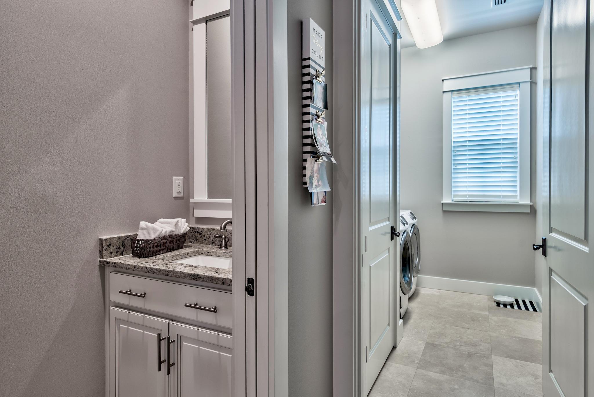 254 Jack Knife Drive Inlet Beach, FL 32461 - Photo 16 of 28 a bathroom with a granite countertop sink and a mirror