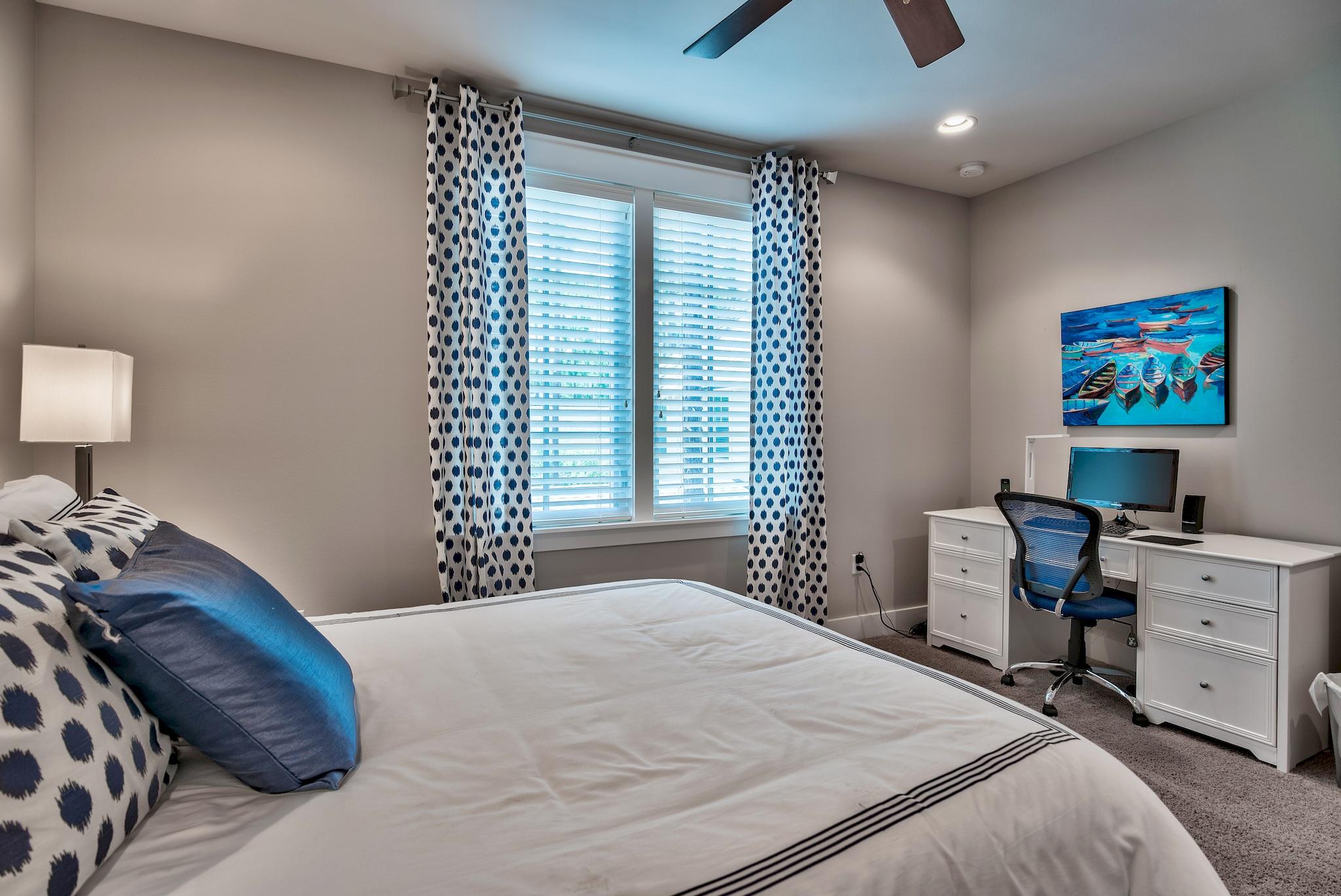 254 Jack Knife Drive Inlet Beach, FL 32461 - Photo 21 of 28 a bedroom with a bed and a desk