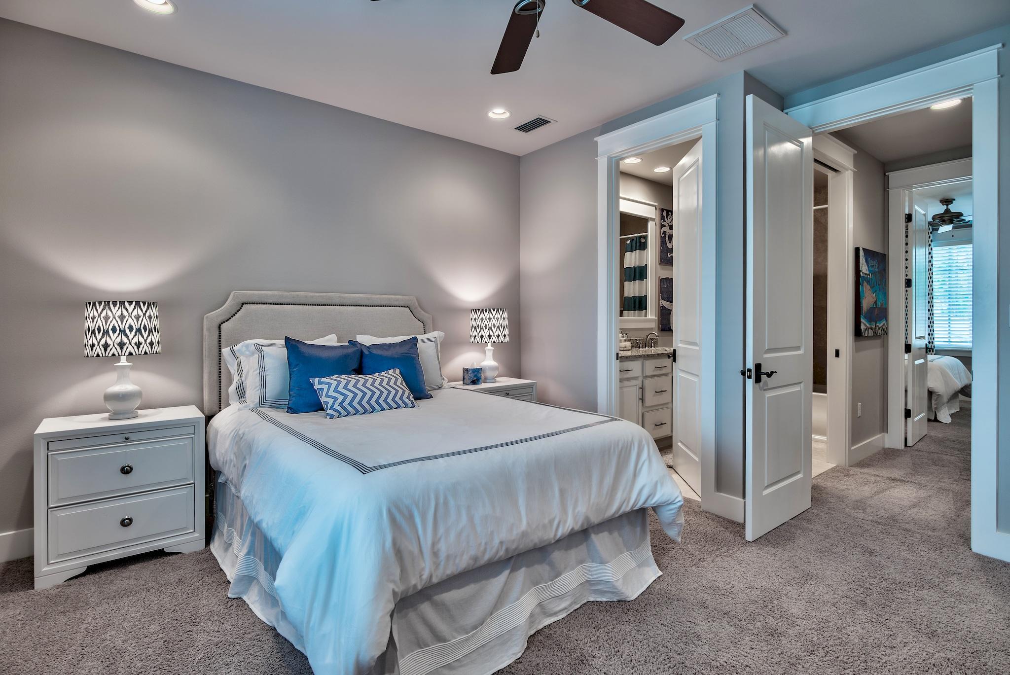 254 Jack Knife Drive Inlet Beach, FL 32461 - Photo 23 of 28 a bedroom with a large bed and chandelier