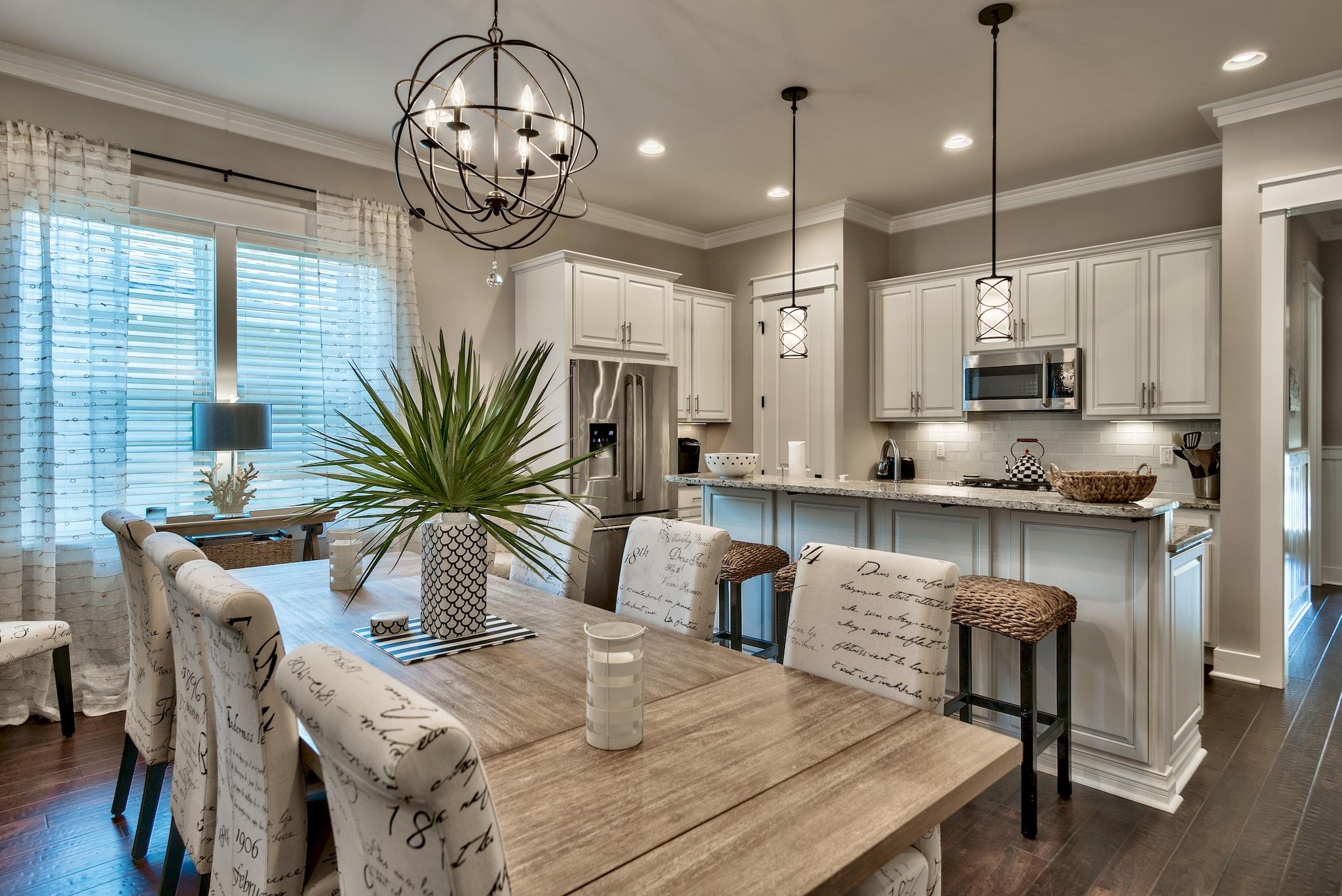 254 Jack Knife Drive Inlet Beach, FL 32461 - Photo 8 of 28 a kitchen with stainless steel appliances granite countertop sink stove refrigerator dining table and chairs