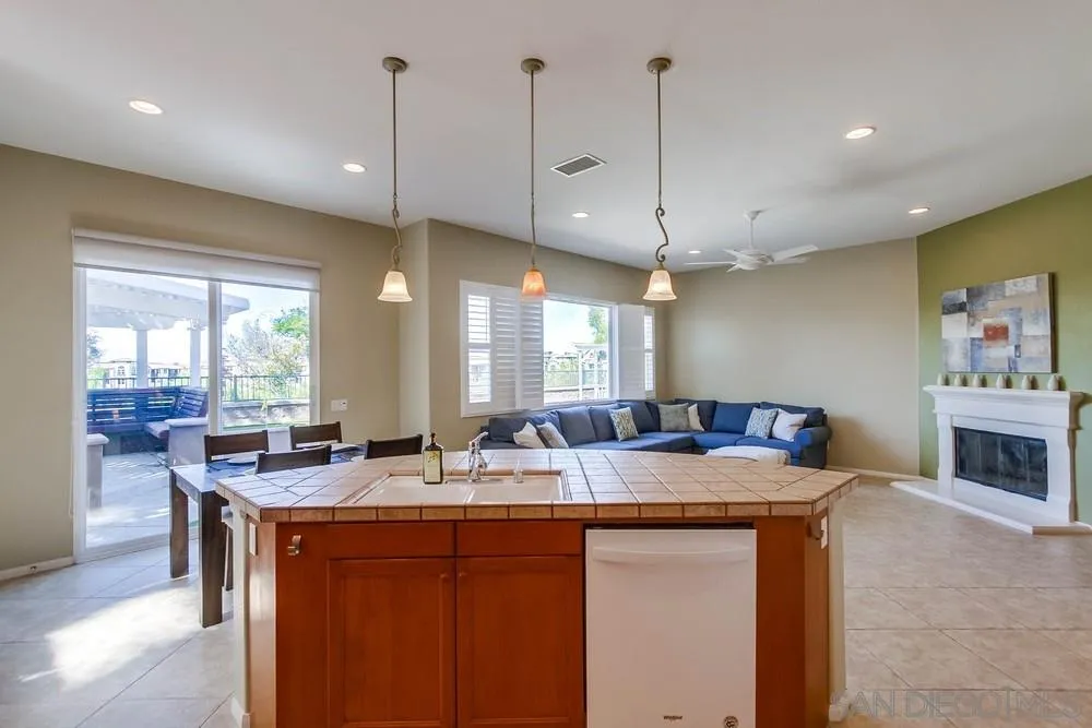 1480 Edgehill Drive Chula Vista, CA 91913 - Photo 12 of 28 a kitchen with granite countertop a sink a counter space appliances and cabinets
