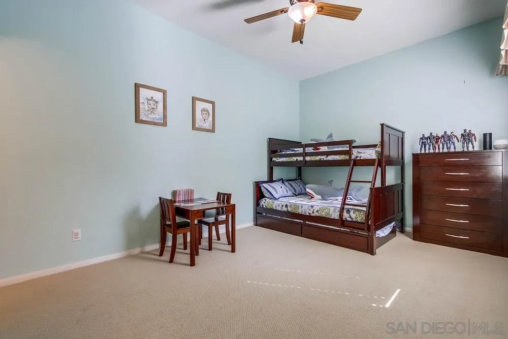 1480 Edgehill Drive Chula Vista, CA 91913 - Photo 14 of 28 a bedroom with furniture and a chair