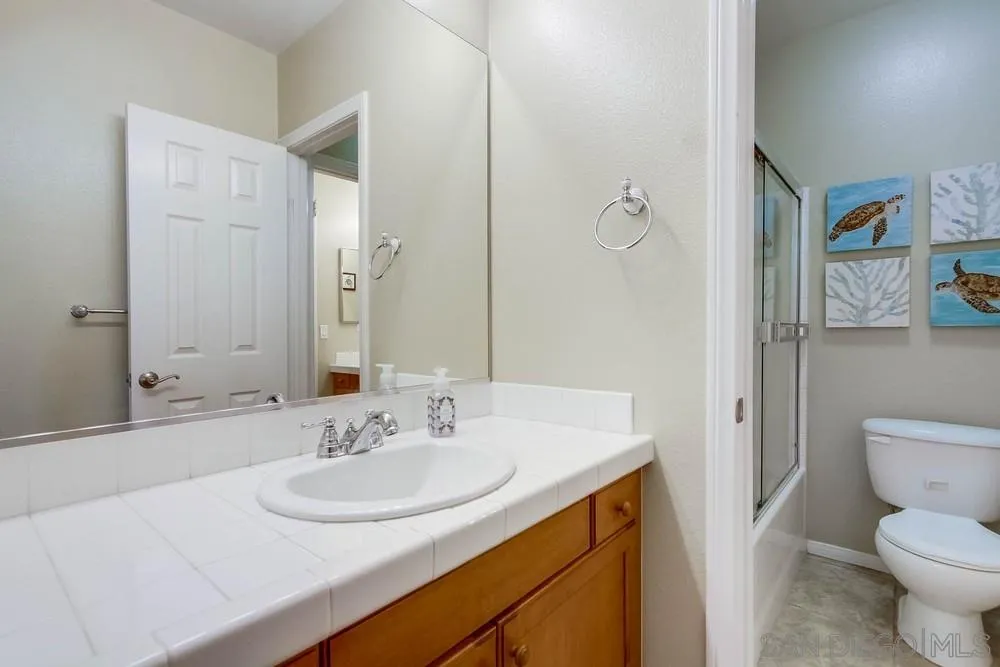 1480 Edgehill Drive Chula Vista, CA 91913 - Photo 15 of 28 a bathroom with a sink and a mirror