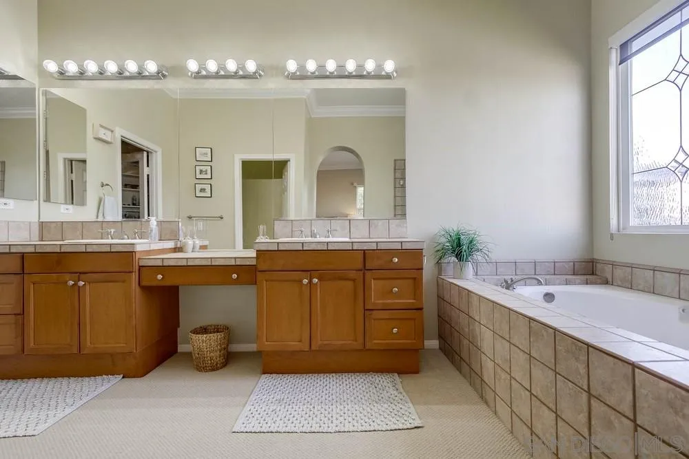 1480 Edgehill Drive Chula Vista, CA 91913 - Photo 18 of 28 a bath room with a sink and a large mirror