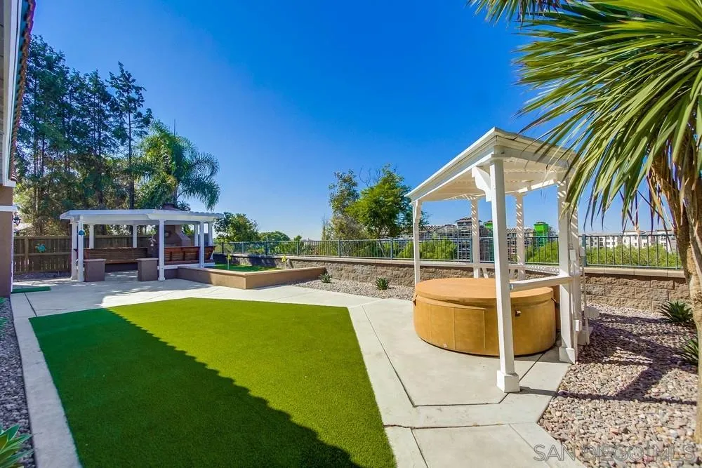 1480 Edgehill Drive Chula Vista, CA 91913 - Photo 21 of 28 a view of a swimming pool with lounge chairs in patio
