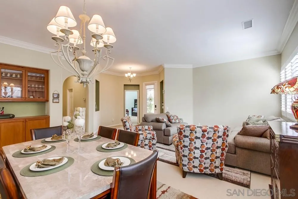 1480 Edgehill Drive Chula Vista, CA 91913 - Photo 6 of 28 a view of a dining room with furniture a chandelier and wooden floor