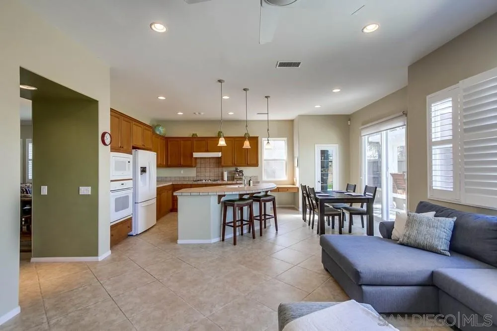 1480 Edgehill Drive Chula Vista, CA 91913 - Photo 9 of 28 a living room with kitchen island furniture and a kitchen view