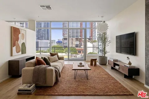 a view of livingroom with furniture and floor to ceiling window
