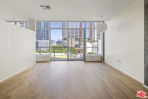 a view of livingroom with furniture and floor to ceiling window