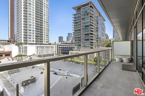 a view of balcony with furniture