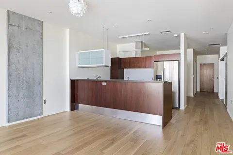 a view of kitchen and wooden floor