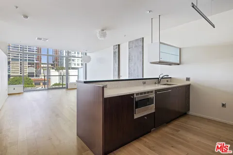 a kitchen with stainless steel appliances granite countertop a stove and a sink