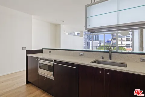 a kitchen with a sink and a window