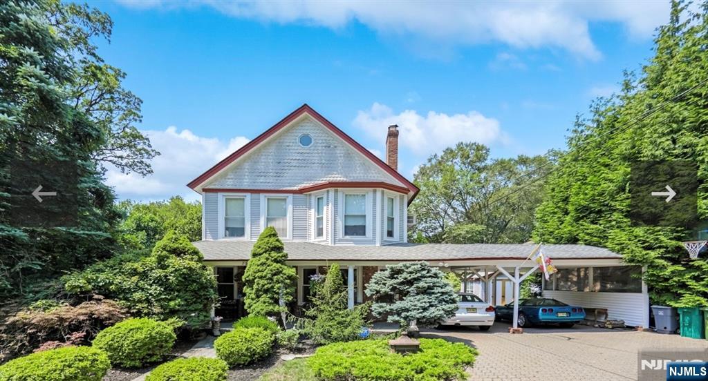 79 North 5th Street Park Ridge, NJ 07656 - Photo 2 of 11 a front view of a house with garden