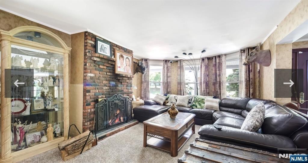79 North 5th Street Park Ridge, NJ 07656 - Photo 4 of 11 a living room with furniture and a large window
