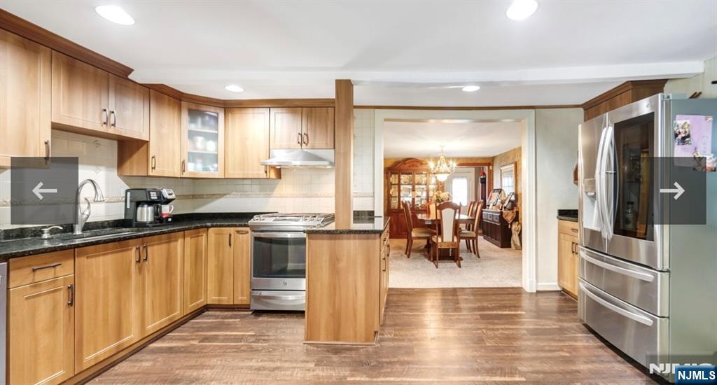 79 North 5th Street Park Ridge, NJ 07656 - Photo 6 of 11 a kitchen with stainless steel appliances granite countertop a refrigerator and a sink