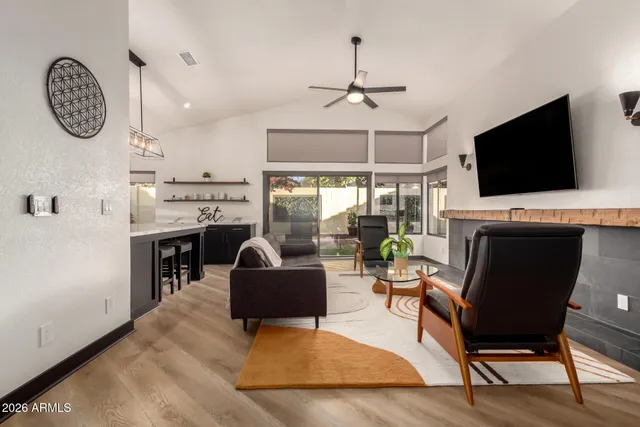 a dining room with furniture a chandelier