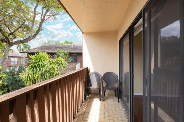 a balcony view with a garden space