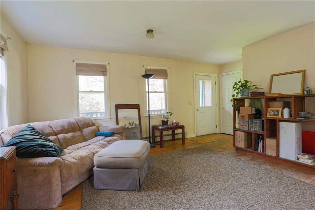 45 Woods Road Belfast, ME 04915 - Photo 8 of 21 Living room. Exterior front door.