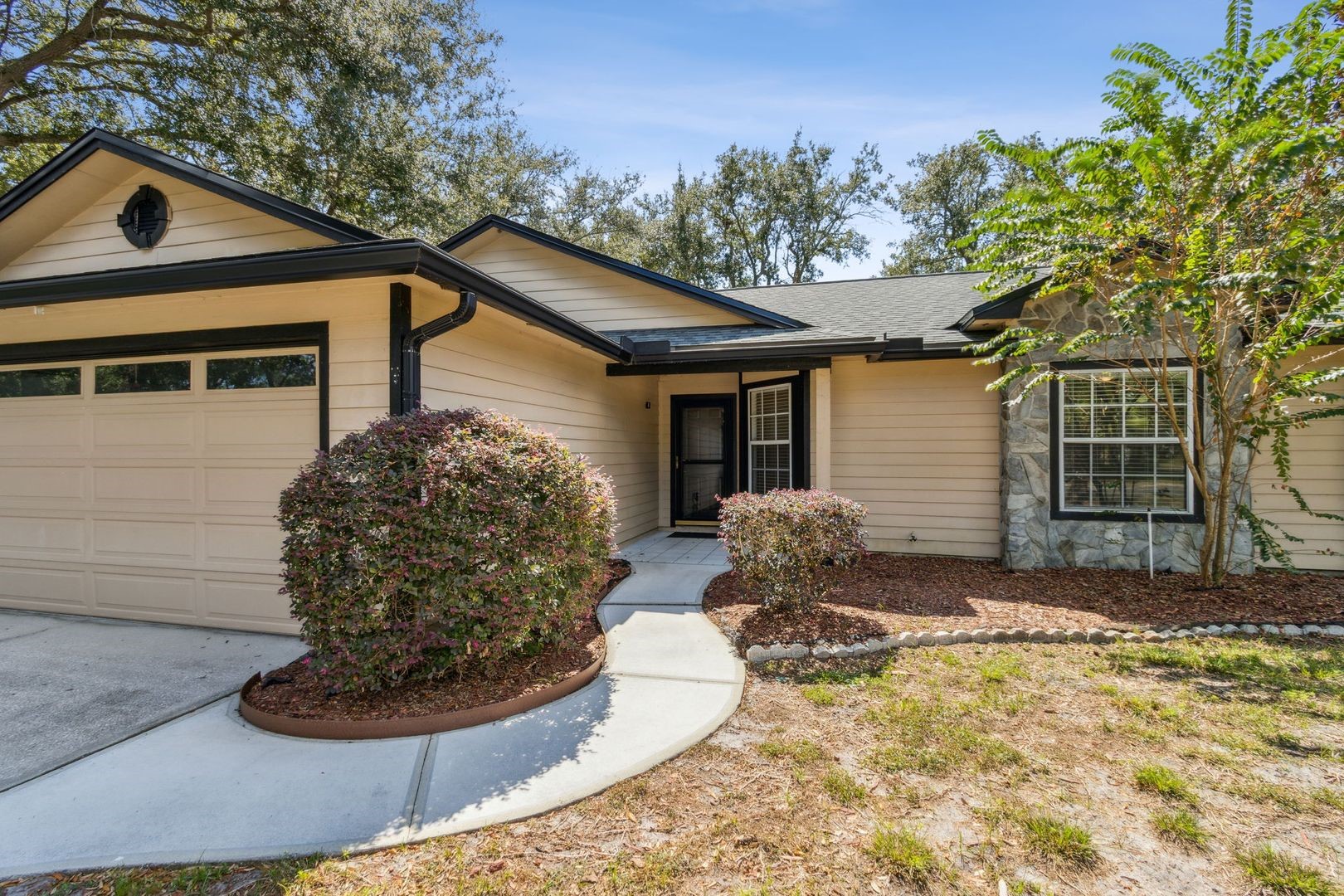 2102 Inverness Road Fernandina Beach, FL 32034 - Photo 2 of 29 a front view of a house with garden