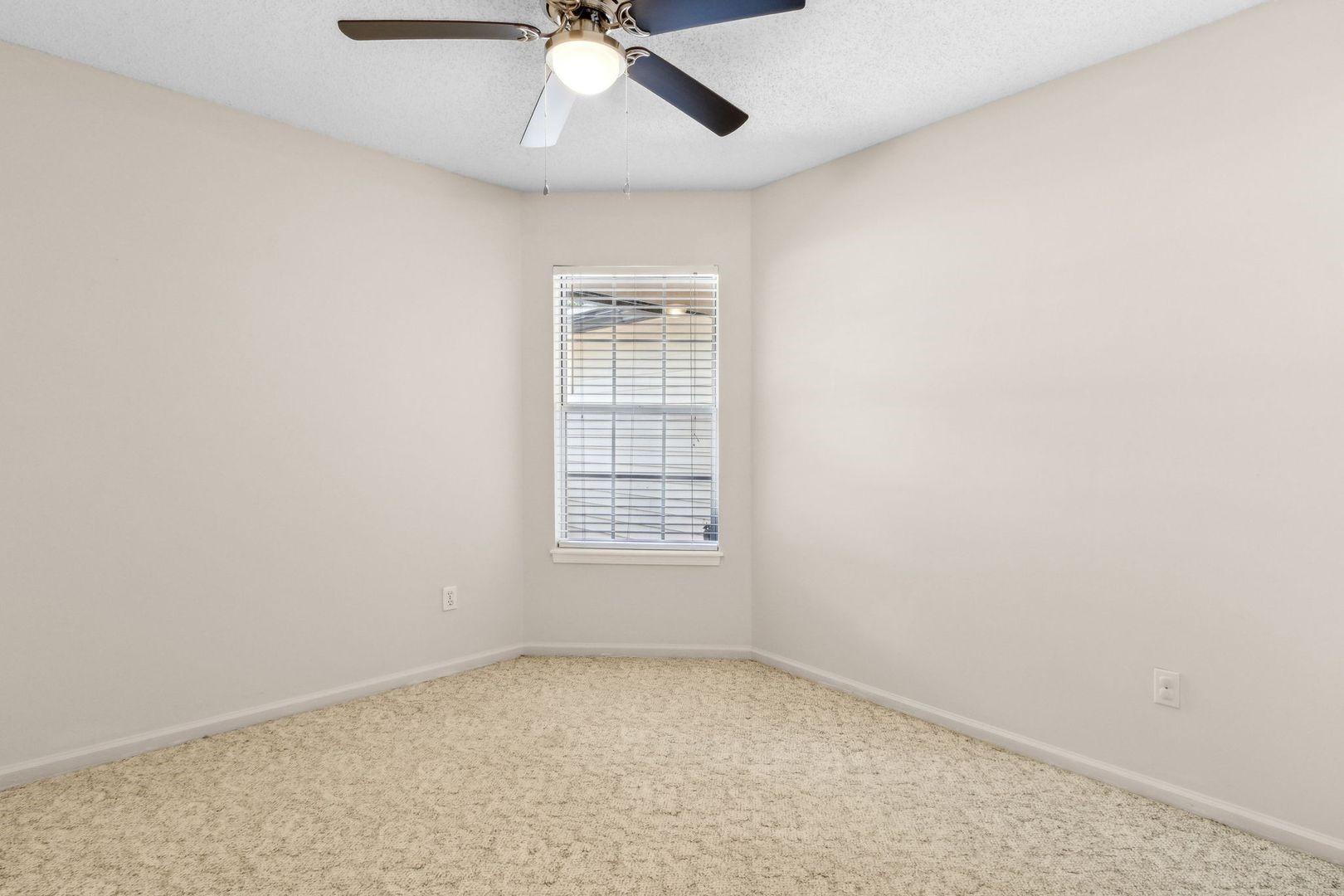 2102 Inverness Road Fernandina Beach, FL 32034 - Photo 21 of 29 an empty room with a window and a fan
