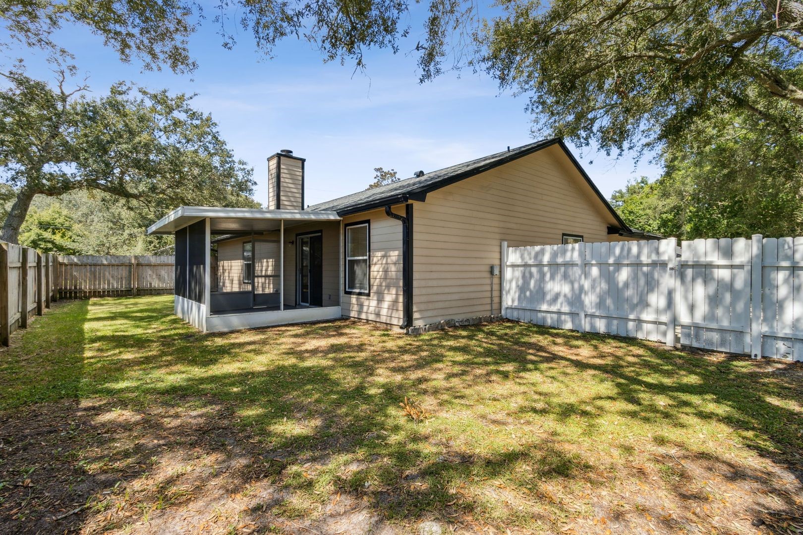 2102 Inverness Road Fernandina Beach, FL 32034 - Photo 27 of 29 a view of a house with a yard and garage