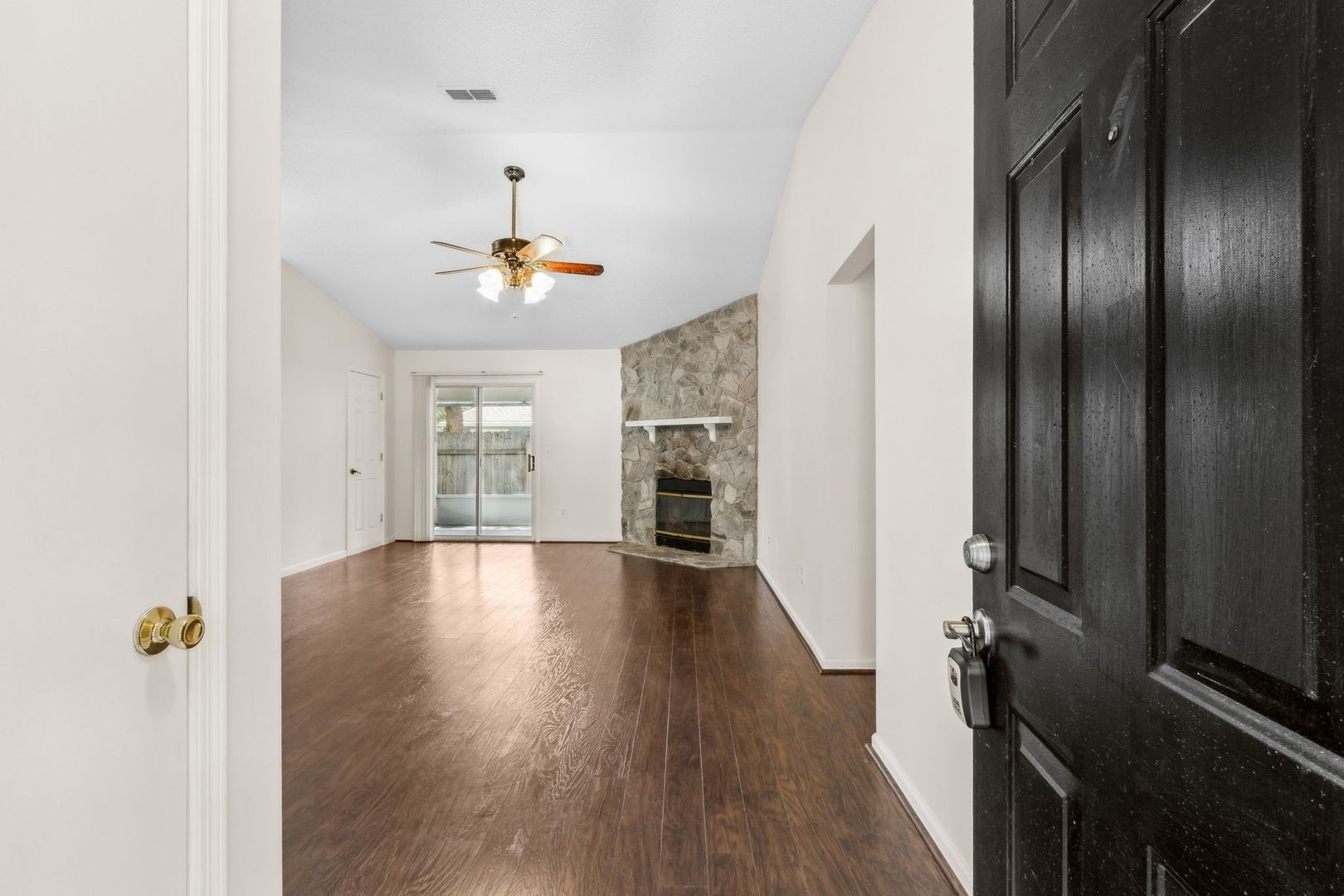 2102 Inverness Road Fernandina Beach, FL 32034 - Photo 4 of 29 wooden floor in an empty room with a window