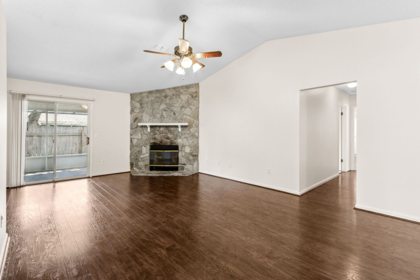 2102 Inverness Road Fernandina Beach, FL 32034 - Photo 6 of 29 an empty room with wooden floor chandelier and windows