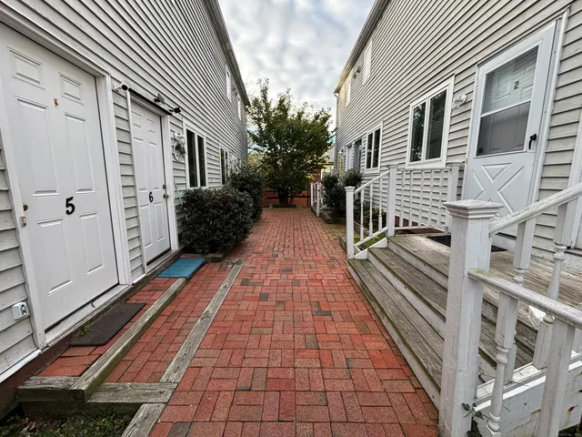 a view of a house with a door and wooden floor