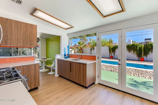 a kitchen with a stove a sink and a microwave