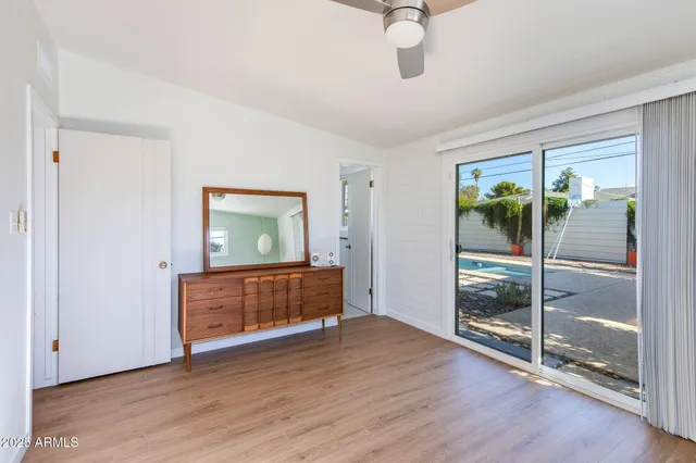 a bathroom with a sink mirror toilet and shower