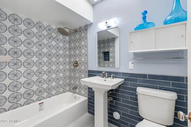 a room with pool table and chairs