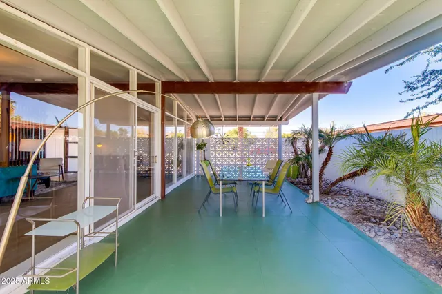 a room with lots of potted plants