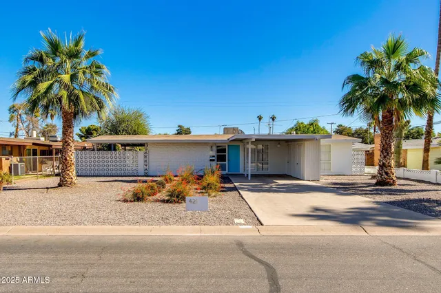 a view of a street with a house